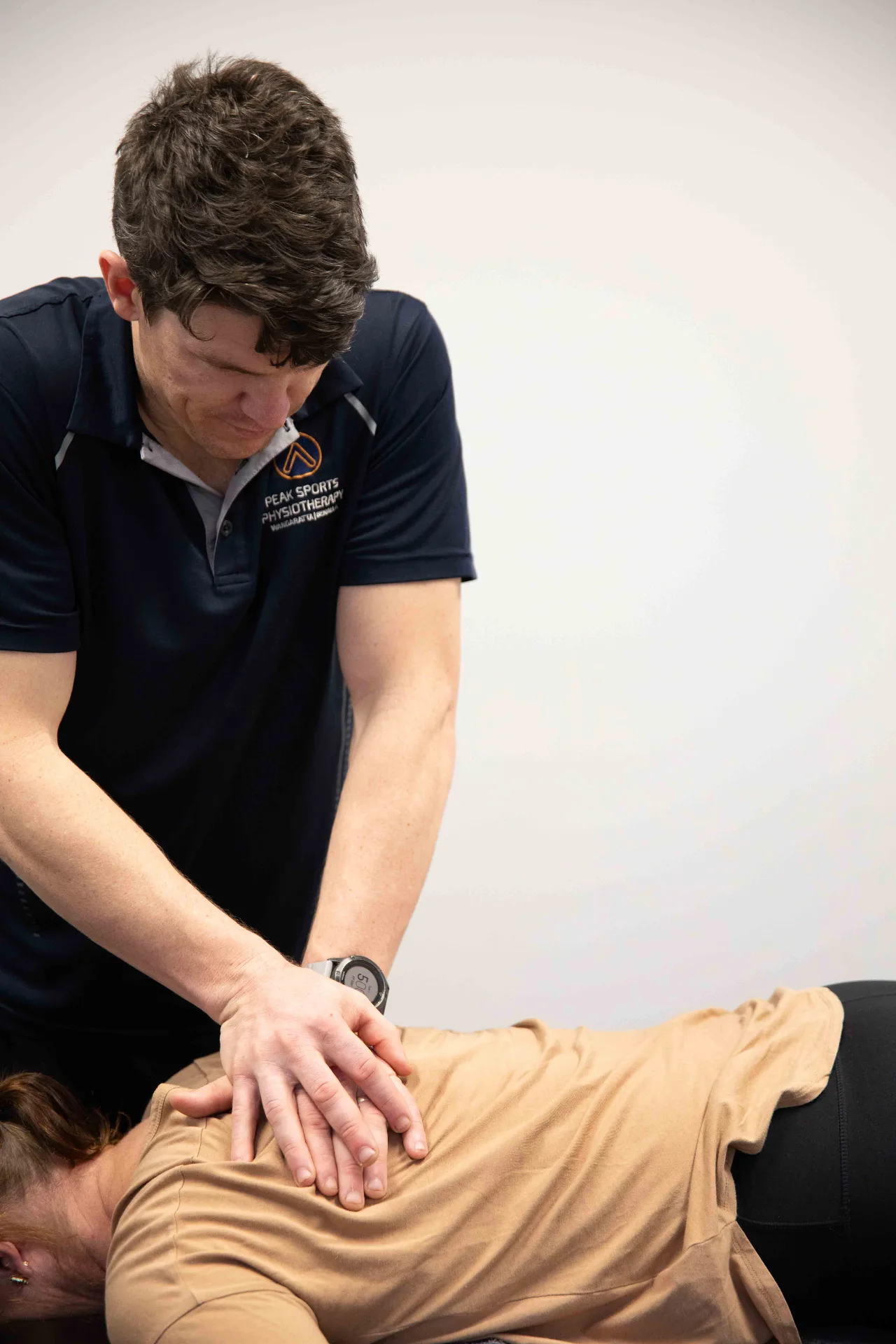 Todd Bird practising physiotherapy techniques at Peak Sports Physiotherapy